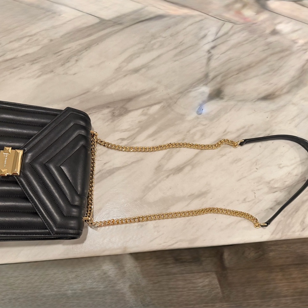 Michael Kors Black Quilted Crossbody Bag with Gold Accents
New with Tags - Picture 4 of 4
